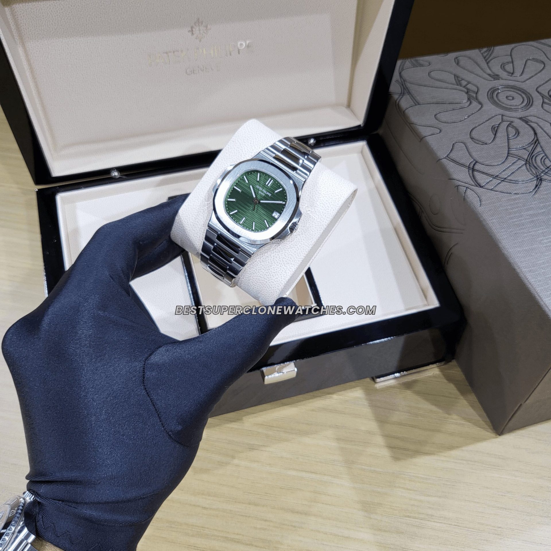 Side view of rose gold-colored case of the super clone Patek Philippe Nautilus