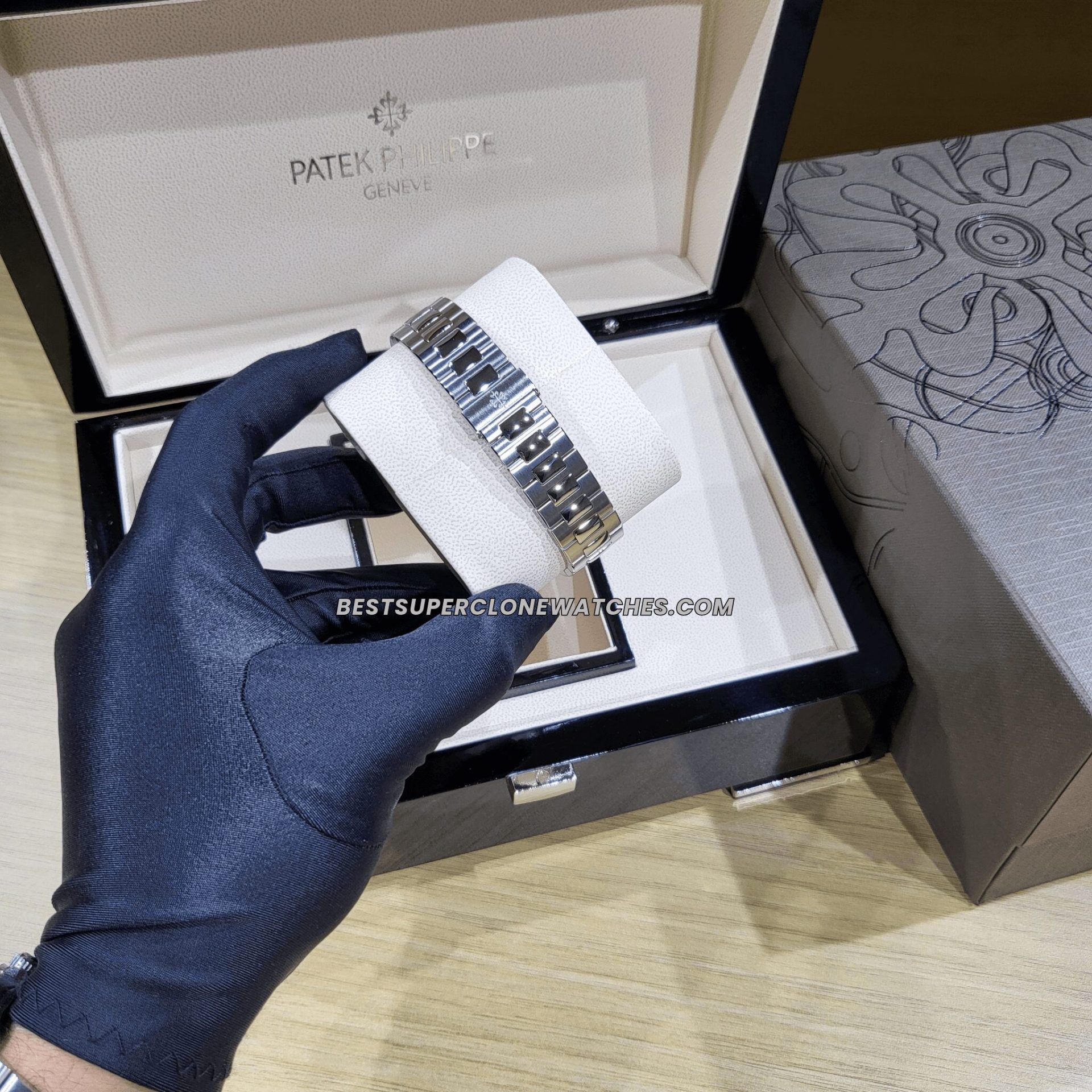 Fake Patek Philippe Nautilus with brown sunburst dial and rose gold-toned casing