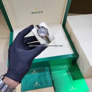 Fake Rolex Datejust watch with Oystersteel and Everose Gold case, diamond-encrusted silver dial, and 2236 movement imitation