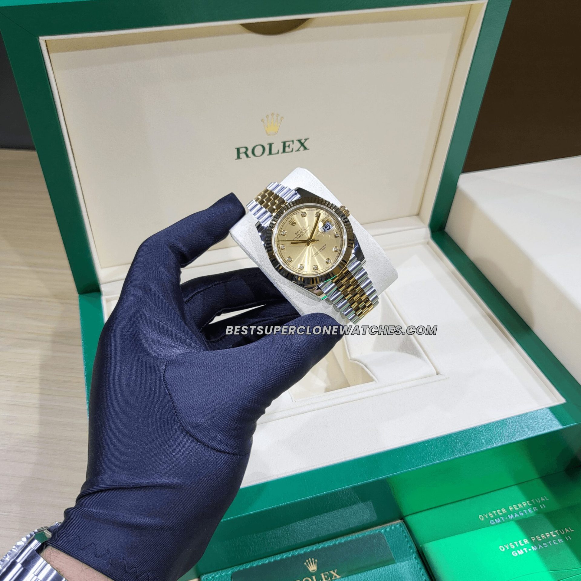 Rolex Datejust 3235 Swiss super clone with champagne dial, diamonds, yellow gold bezel, and Oystersteel case—luxury replica watch.