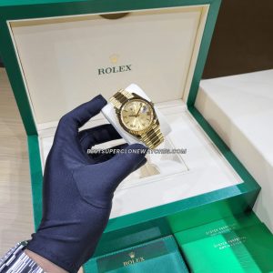 High-quality replica of Rolex Day-Date featuring champagne dial and fluted bezel