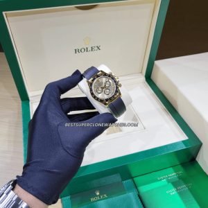 Luxury fake Rolex Daytona with golden dial and chronograph functions on oysterflex strap