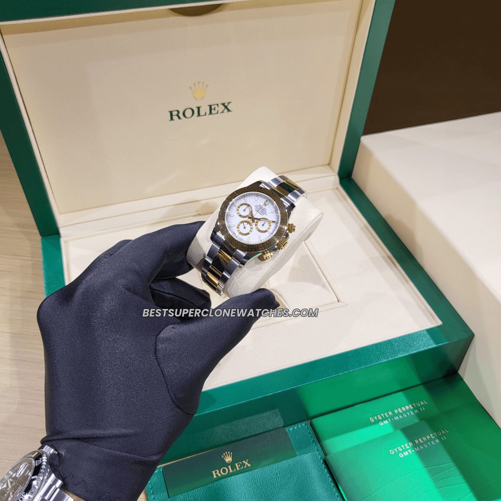 Replica Rolex Daytona with 4131 clone movement featuring two-tone yellow Rolesor and white dial