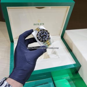 High-quality replica Rolex Sea-Dweller showing yellow gold bezel and robust Oystersteel case