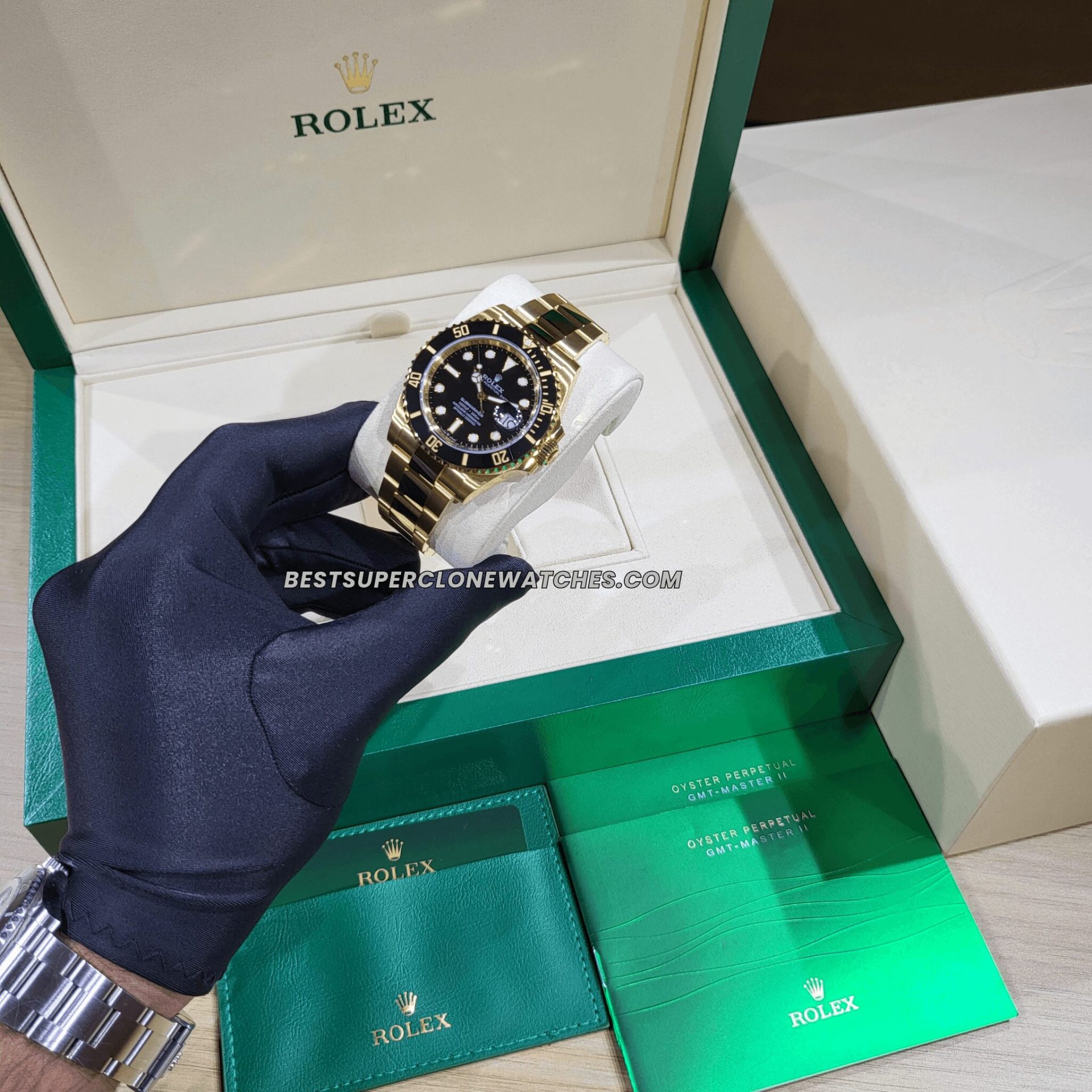 Detailed view of Rolex Submariner super clone in yellow gold with date window