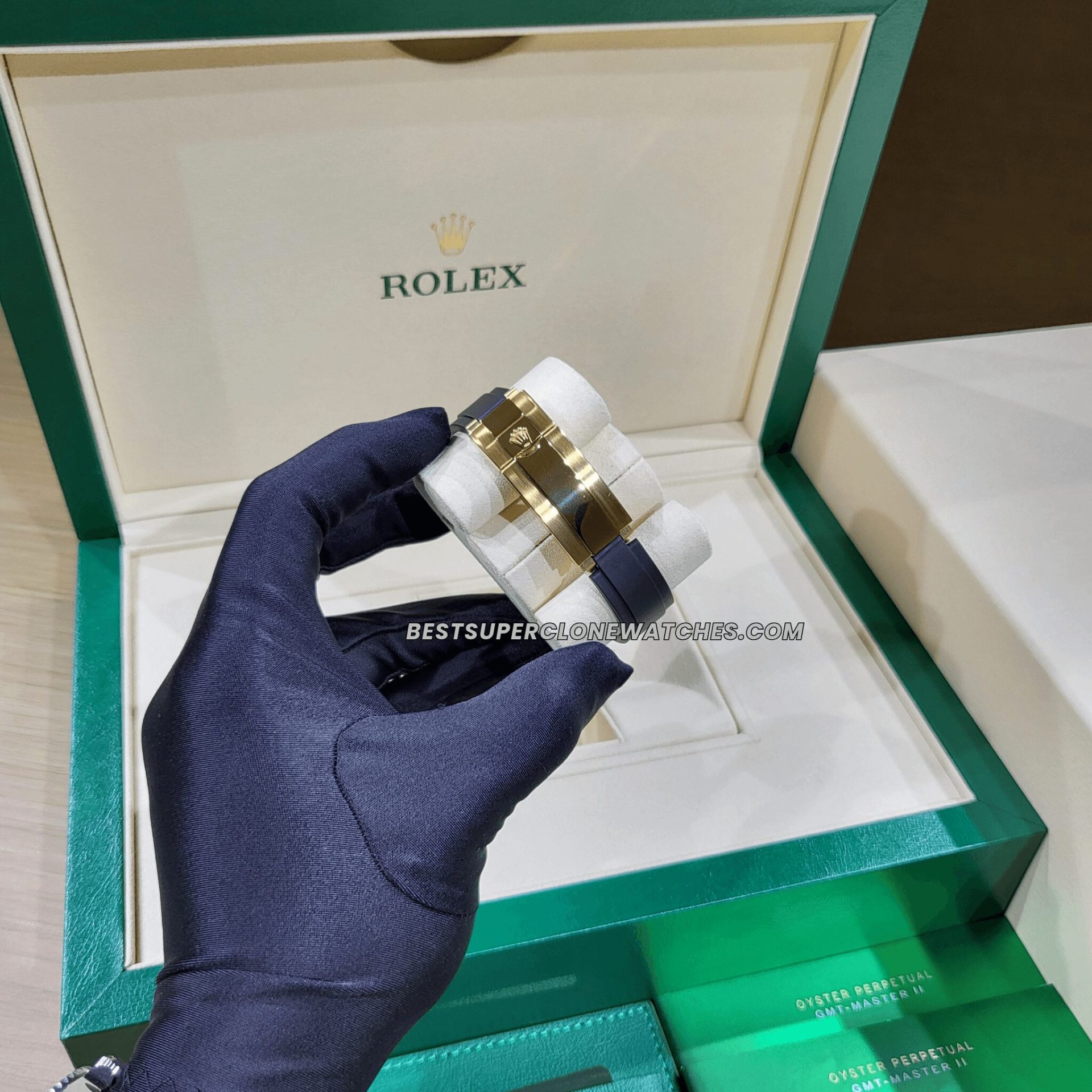 High-quality replica Rolex Yacht-Master featuring a bold black dial, yellow gold case, and flexible Oysterflex strap